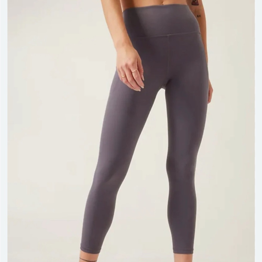 Athleta Stash Pocket Salutation Tight in Charcoal